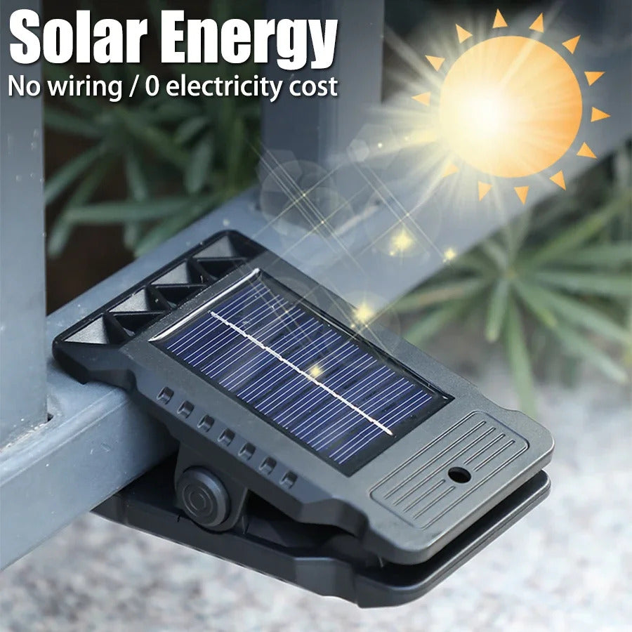 Outdoor solar LED light with clamp